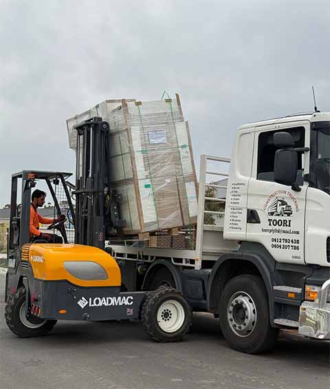 forklift in use to load the truck